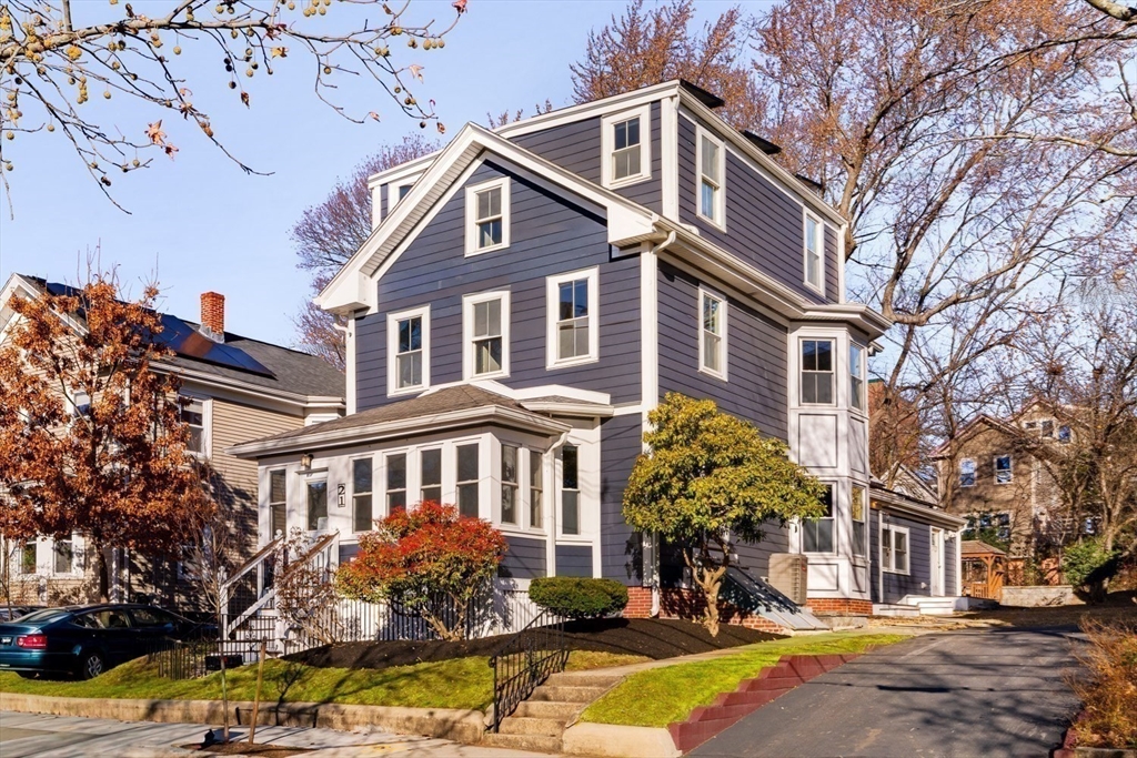 21 Berkeley Street Somerville, MA 02143 - Photo 36 of 36 a front view of a building with street view and trees
