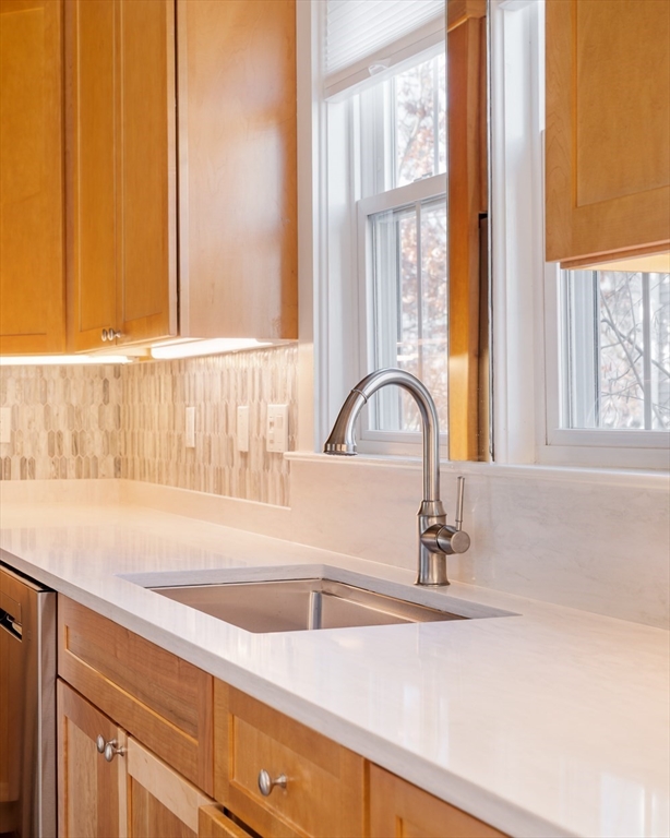 21 Berkeley Street Somerville, MA 02143 - Photo 4 of 36 a kitchen with a sink and a window