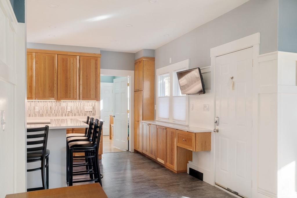 21 Berkeley Street Somerville, MA 02143 - Photo 5 of 36 a bedroom with furniture and a window