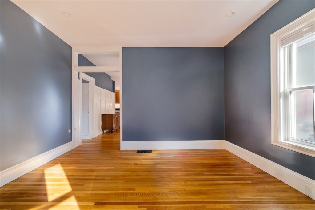 21 Berkeley Street Somerville, MA 02143 - Photo 10 of 36 a view of empty room with wooden floor