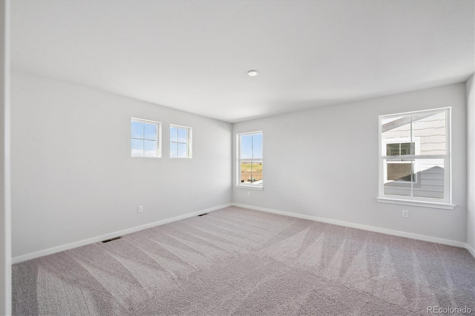 14434 Ranch Street Mead, CO 80504 - Photo 22 of 27 an empty room with windows