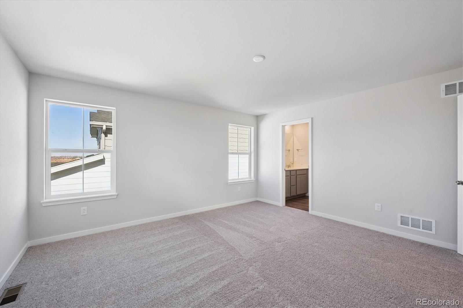 14434 Ranch Street Mead, CO 80504 - Photo 23 of 27 an empty room with windows