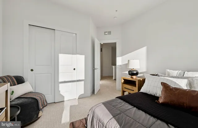 a bedroom with furniture and a couch