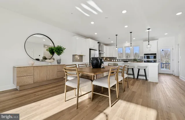 a view of a balcony with wooden benches and outdoor seating