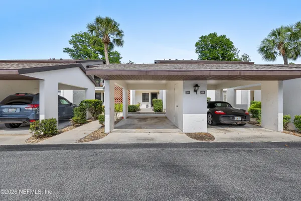 a view of a car park in front of house