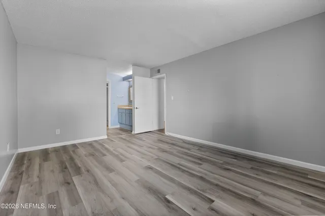 a view of storage and utility room with empty racks