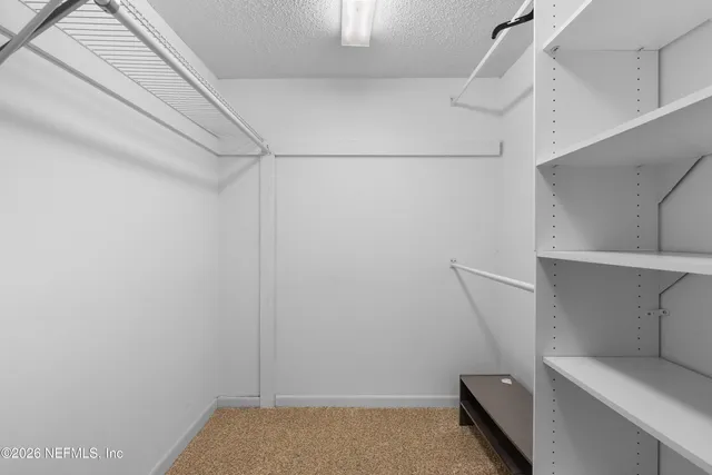 a bathroom with a granite countertop sink mirror and shower