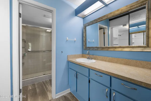 a bathroom with a sink and a mirror
