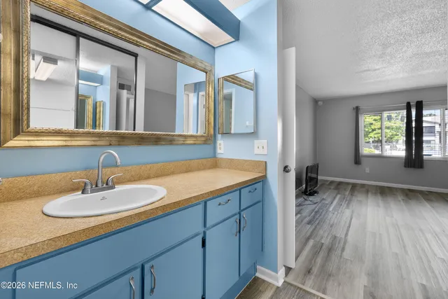 a bathroom with a shower a toilet and a sink