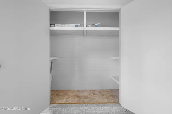 a view of a house with swimming pool and sitting area