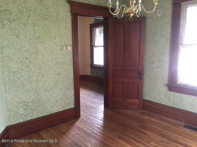 234 Ridge Street Honesdale, PA 18431 - Photo 12 of 20 a view of a hallway with wooden floor and stairs