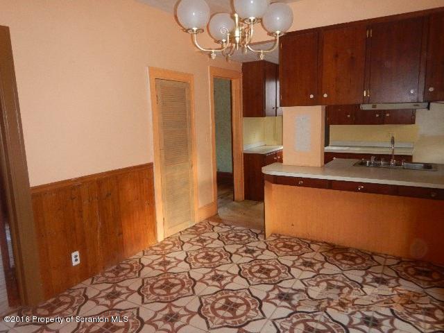 234 Ridge Street Honesdale, PA 18431 - Photo 9 of 20 a kitchen with stainless steel appliances granite countertop a refrigerator and a stove with wooden floor