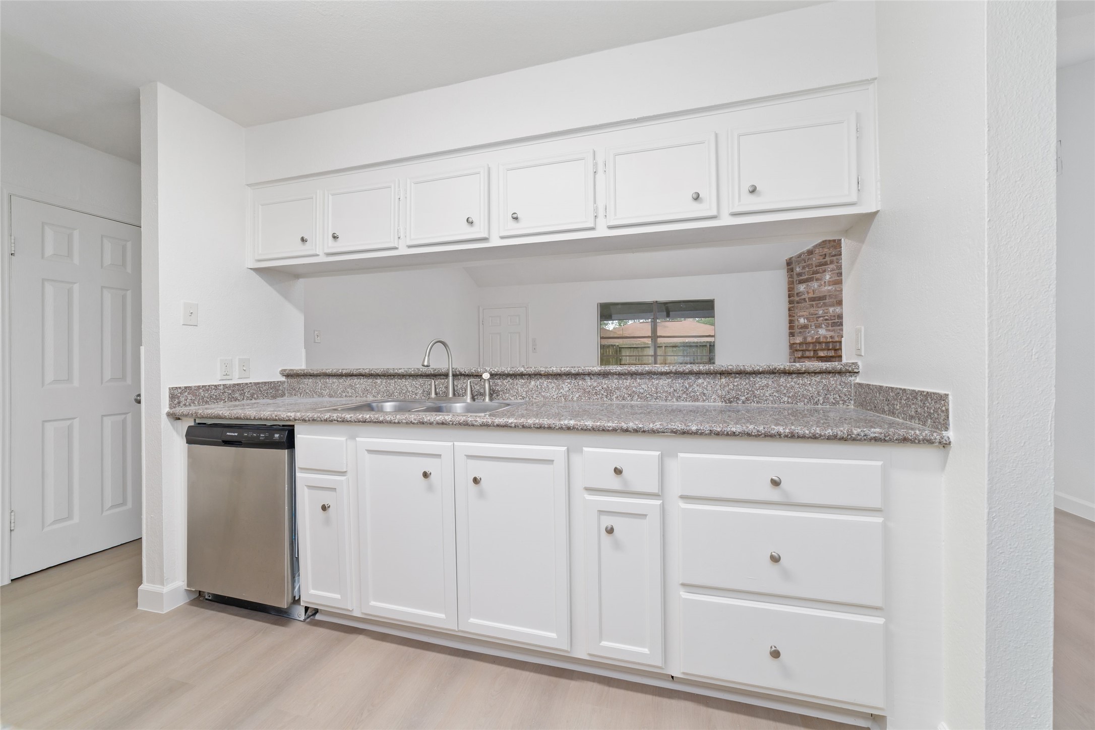 5023 Monteith Drive Spring, TX 77373 - Photo 9 of 20 Kitchen with an open pass-through that connects seamlessly to the living area, keeping the space light, open, and perfect for everyday living.