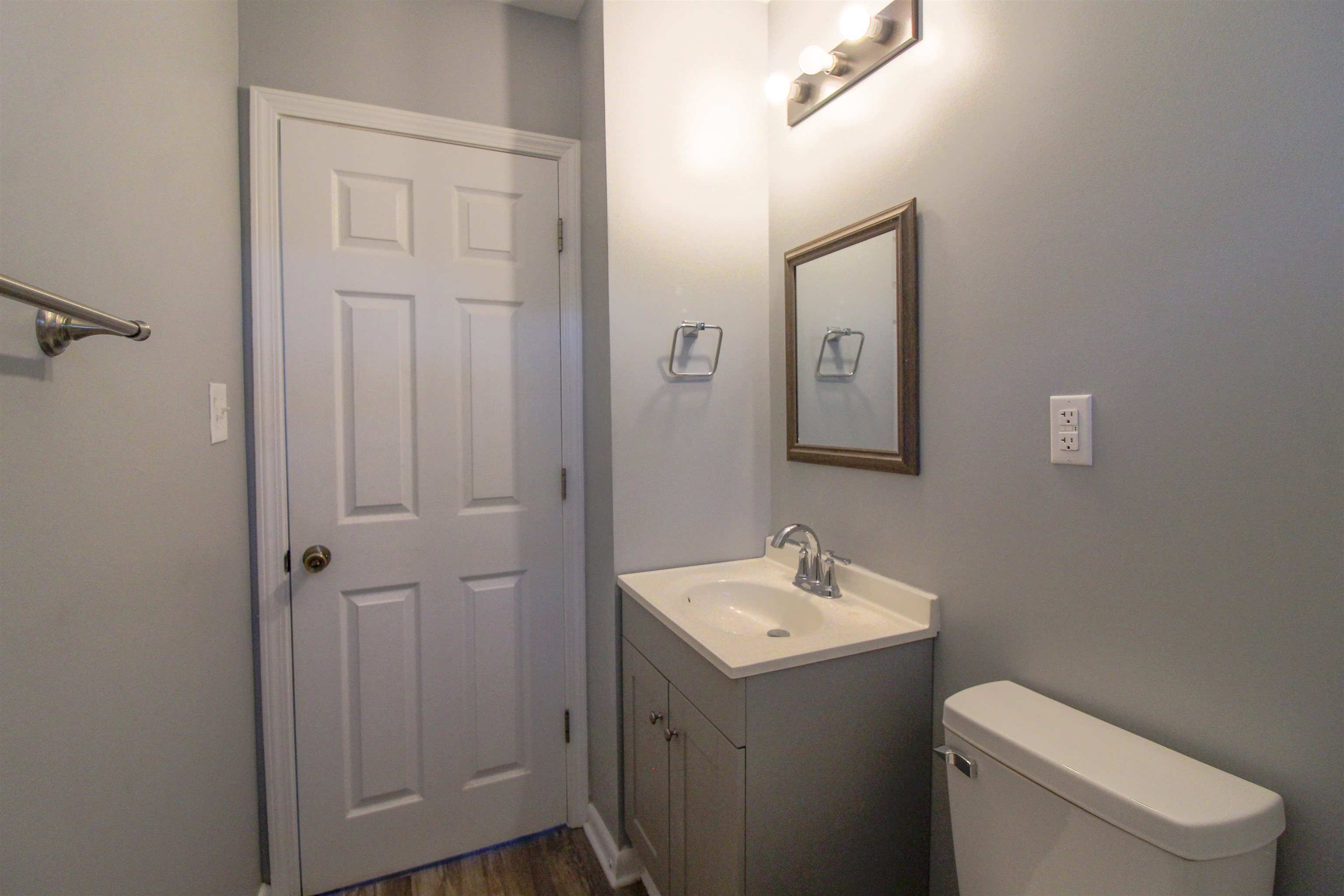 284 Highland Street Ripley, TN 38063 - Photo 15 of 25 a bathroom with a toilet sink and mirror