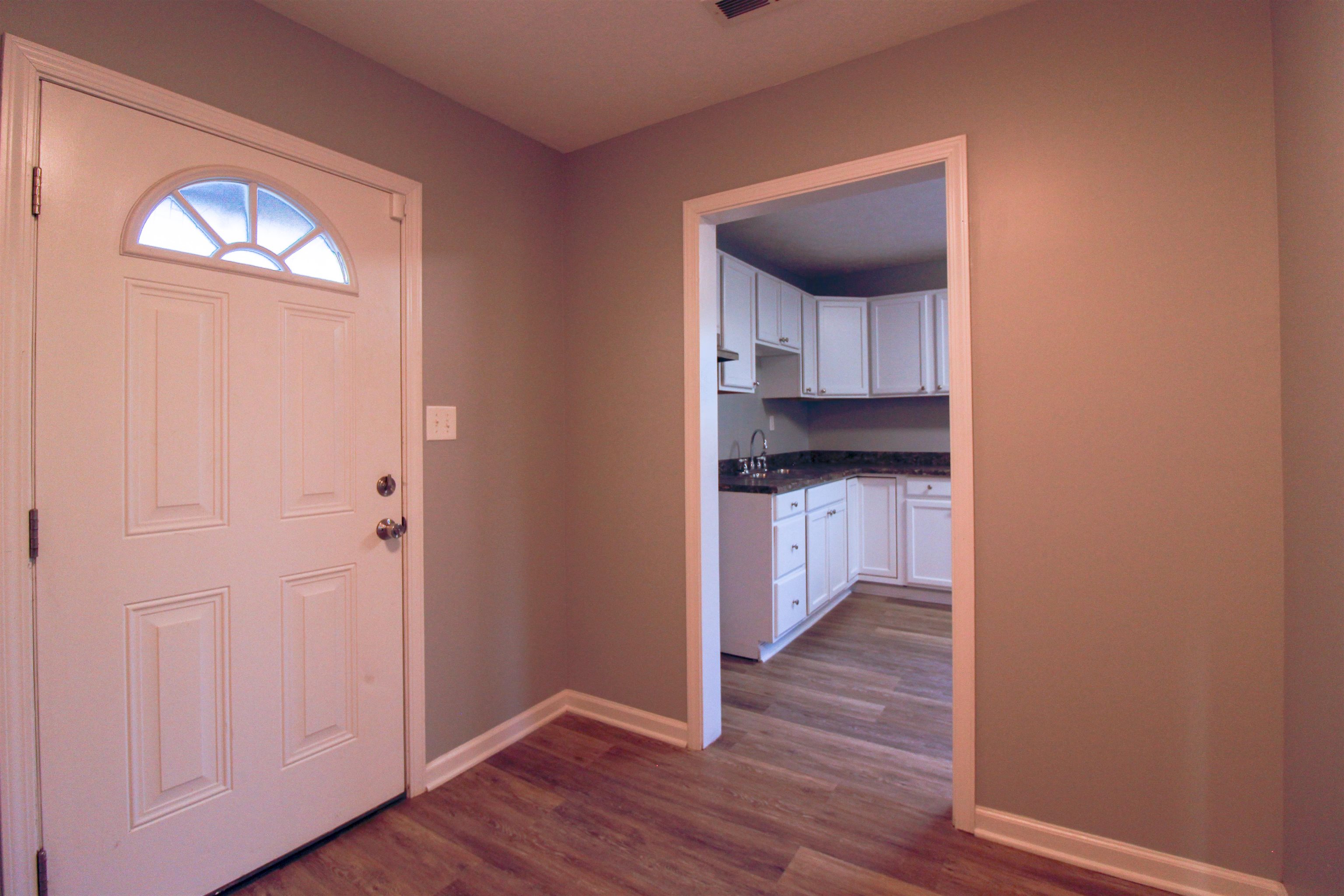 284 Highland Street Ripley, TN 38063 - Photo 18 of 25 a view of a kitchen from a hallway