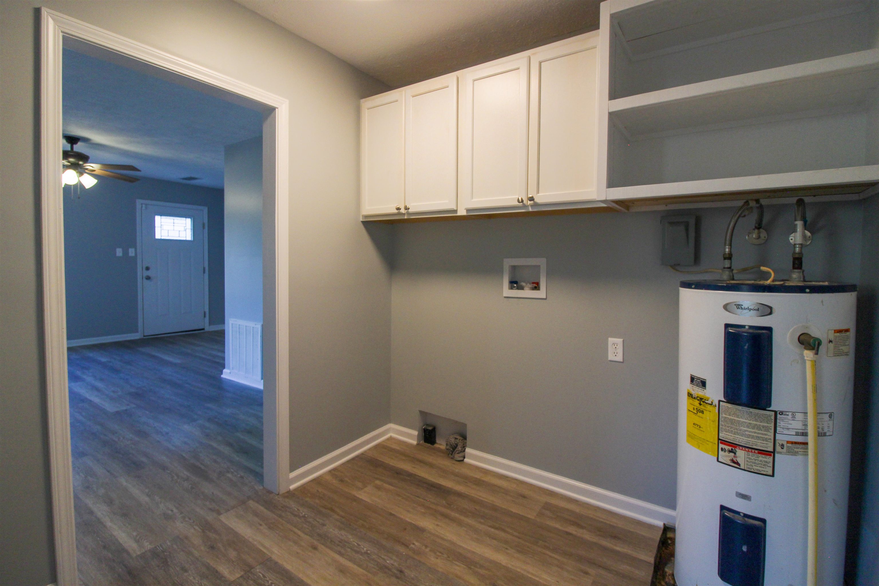 284 Highland Street Ripley, TN 38063 - Photo 19 of 25 a view of storage and utility room with wooden floor