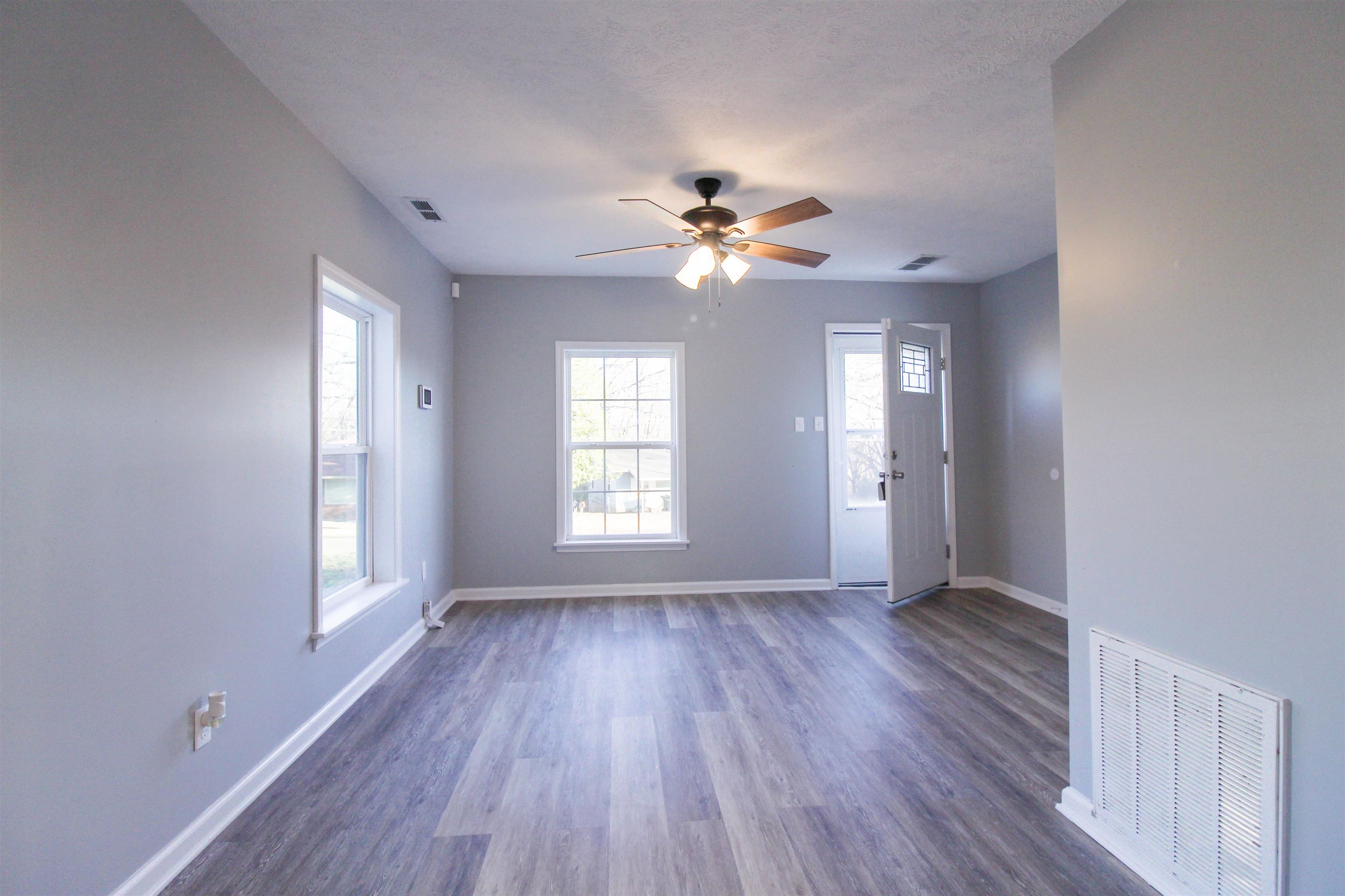284 Highland Street Ripley, TN 38063 - Photo 2 of 25 wooden floor in an empty room with a window