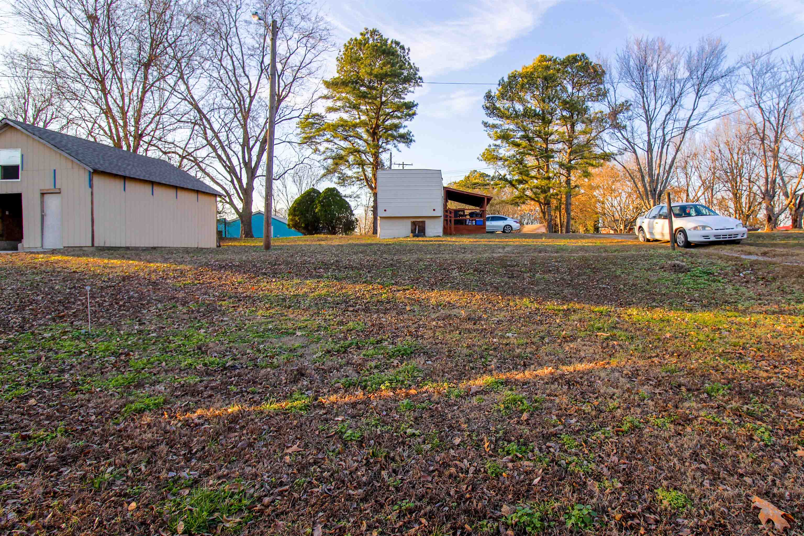 284 Highland Street Ripley, TN 38063 - Photo 21 of 25 a backyard of a house with lots of green space
