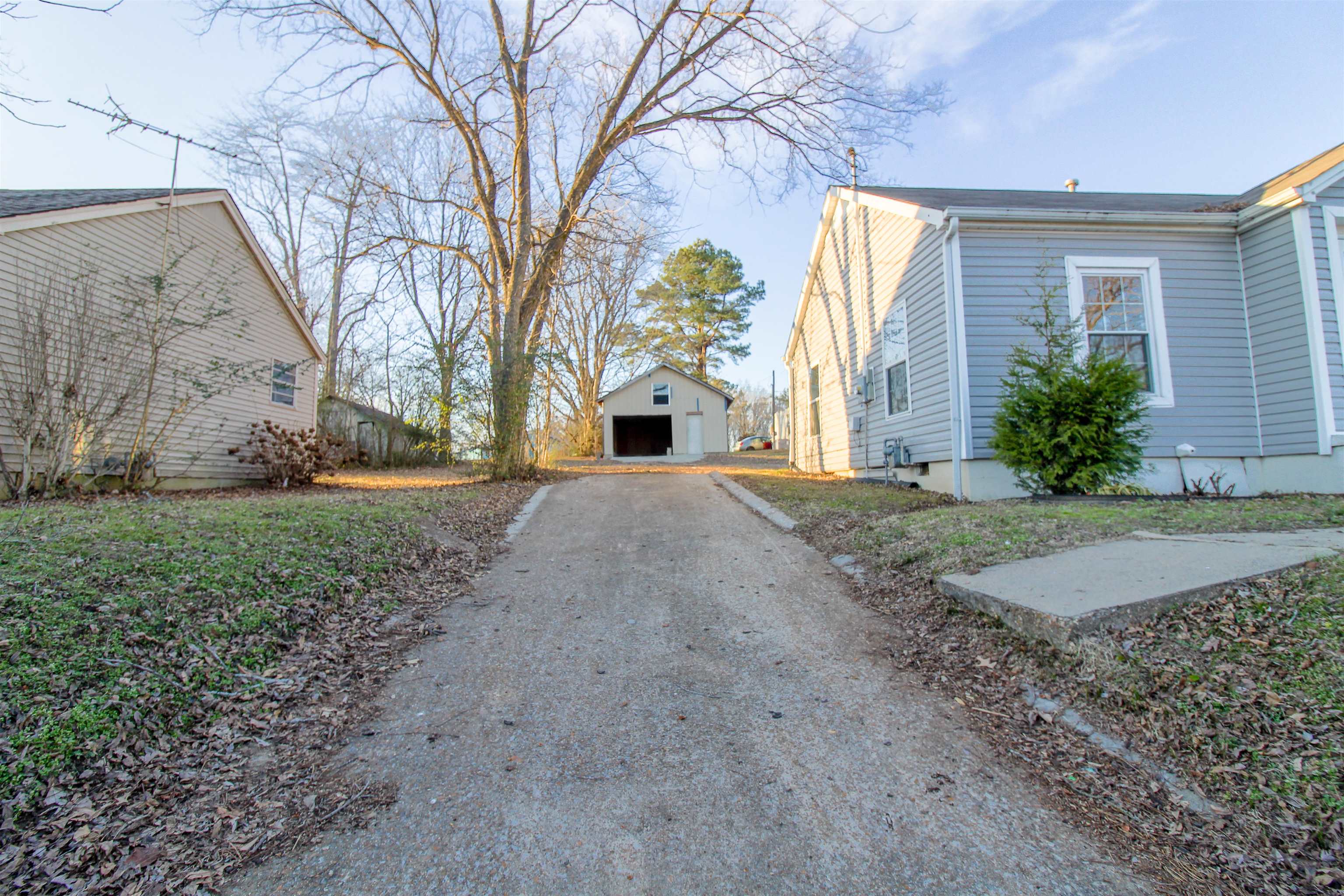 284 Highland Street Ripley, TN 38063 - Photo 24 of 25 a front view of a house with garden and yard