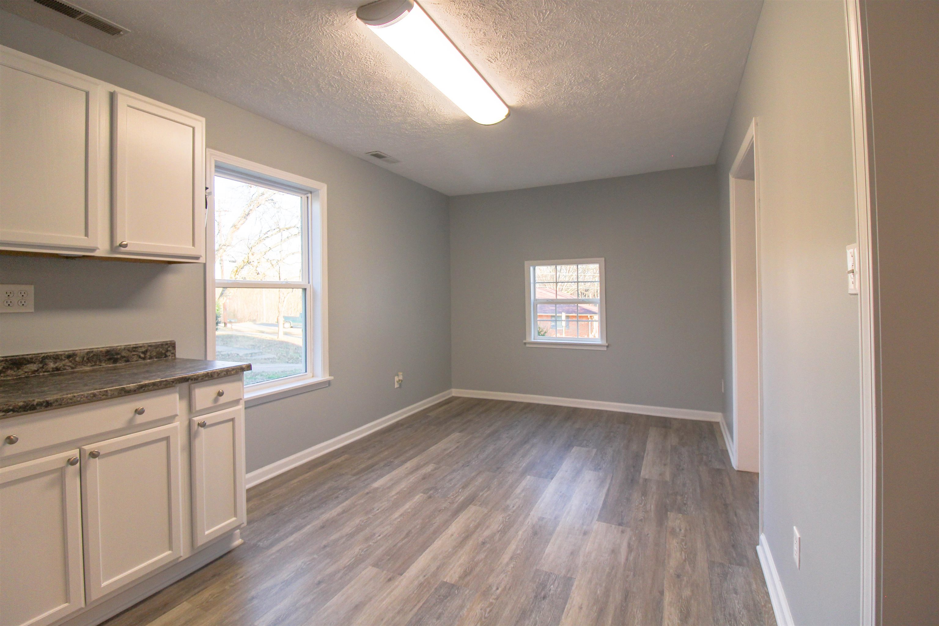284 Highland Street Ripley, TN 38063 - Photo 5 of 25 wooden floor in an empty room with a window