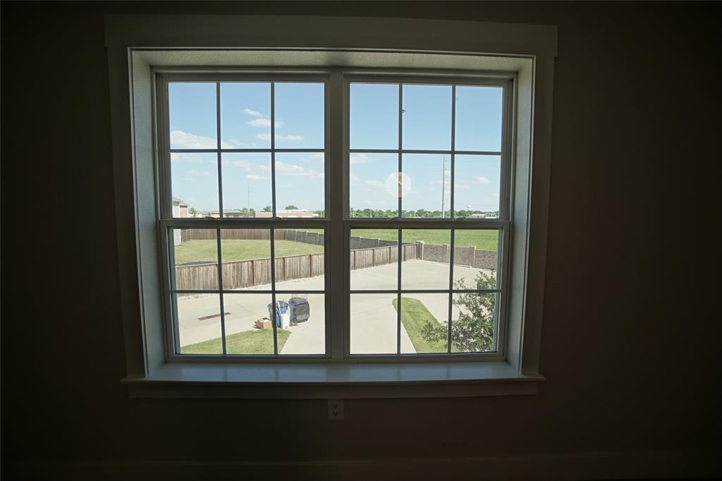 1764 Palladio Loop Princeton, TX 75407 - Photo 31 of 40 Double-hung window with grilles, framed by white casing and a deep sill