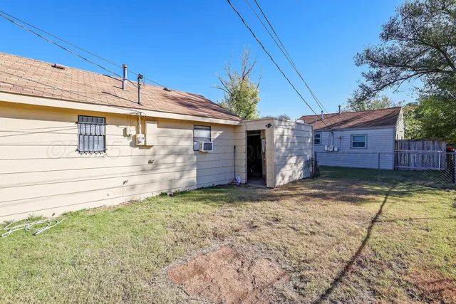 a view of a back yard of the house