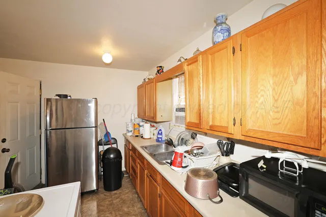 a utility room with sink washer and dryer