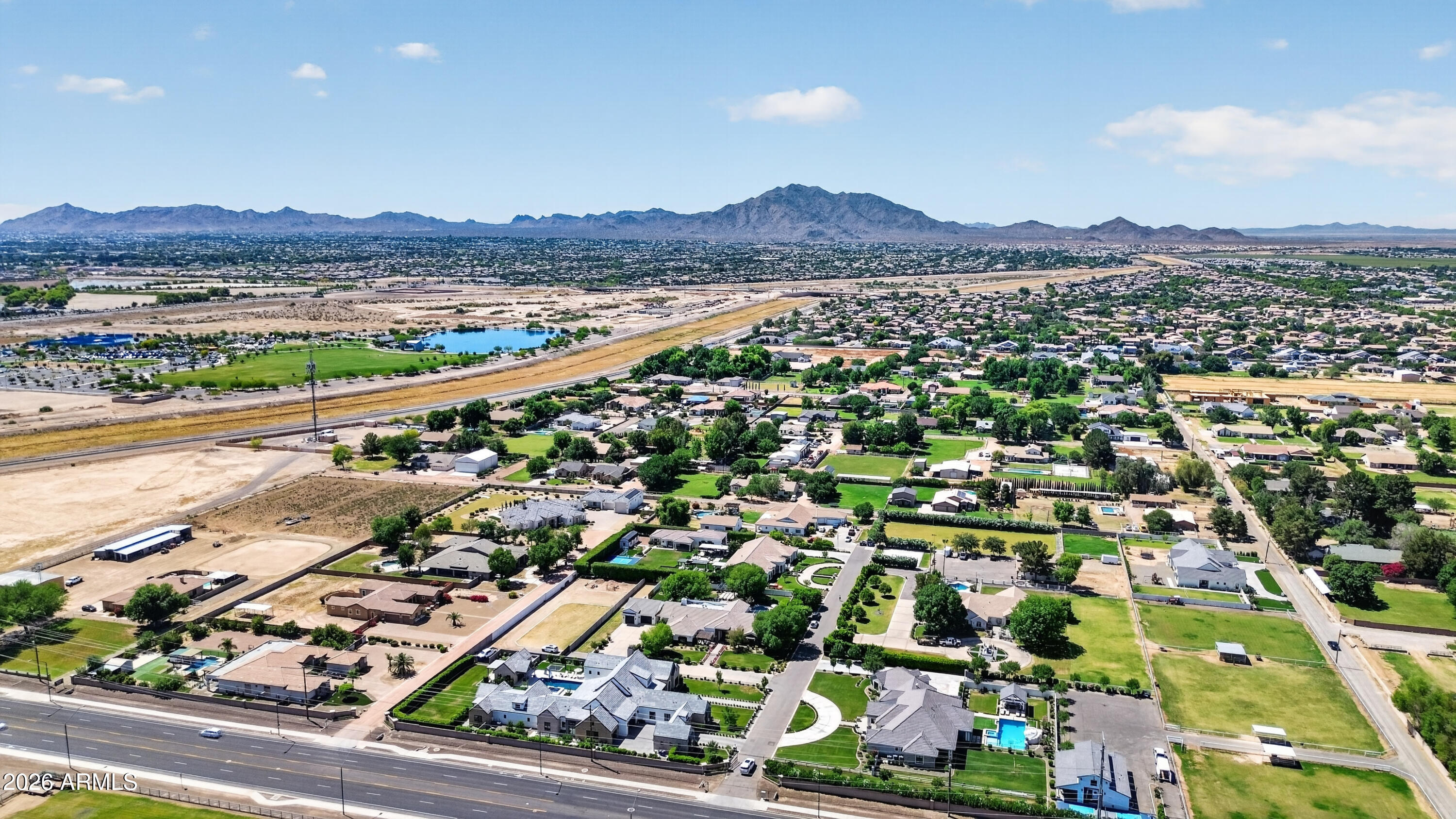 2677 East Queen Creek Road Gilbert, AZ 85297 - Photo 127 of 128 an aerial view of residential houses with outdoor space and street view