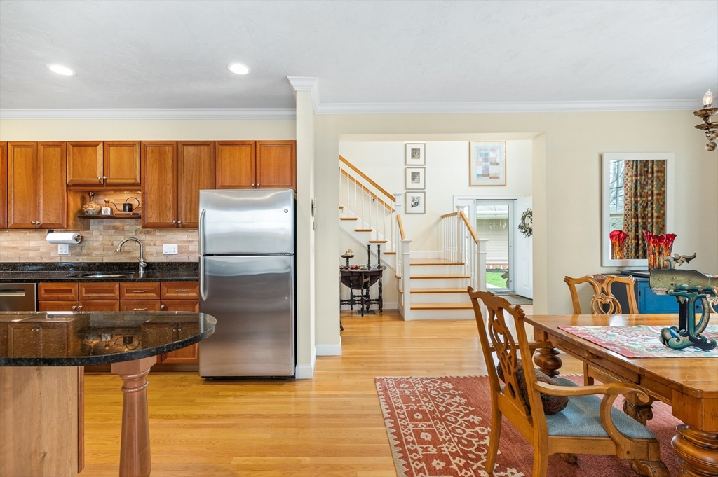 6 Essex Road, Unit 8 Ipswich, MA 01938 - Photo 4 of 35 a kitchen with stainless steel appliances granite countertop a refrigerator and a stove top oven