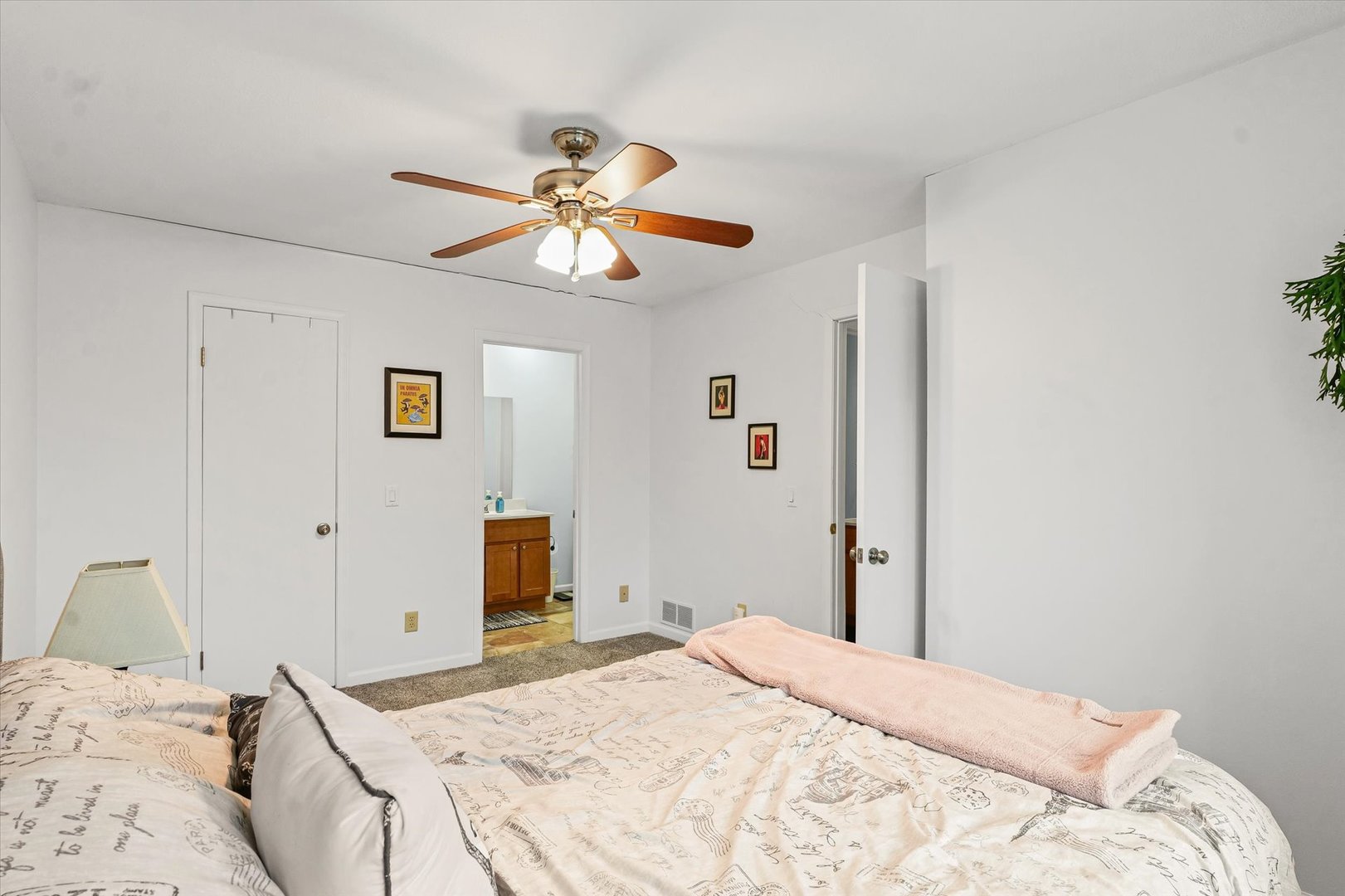 2159 Harbor Town Circle, Unit 2159 Champaign, IL 61821 - Photo 14 of 22 a bedroom with a bed and a chandelier