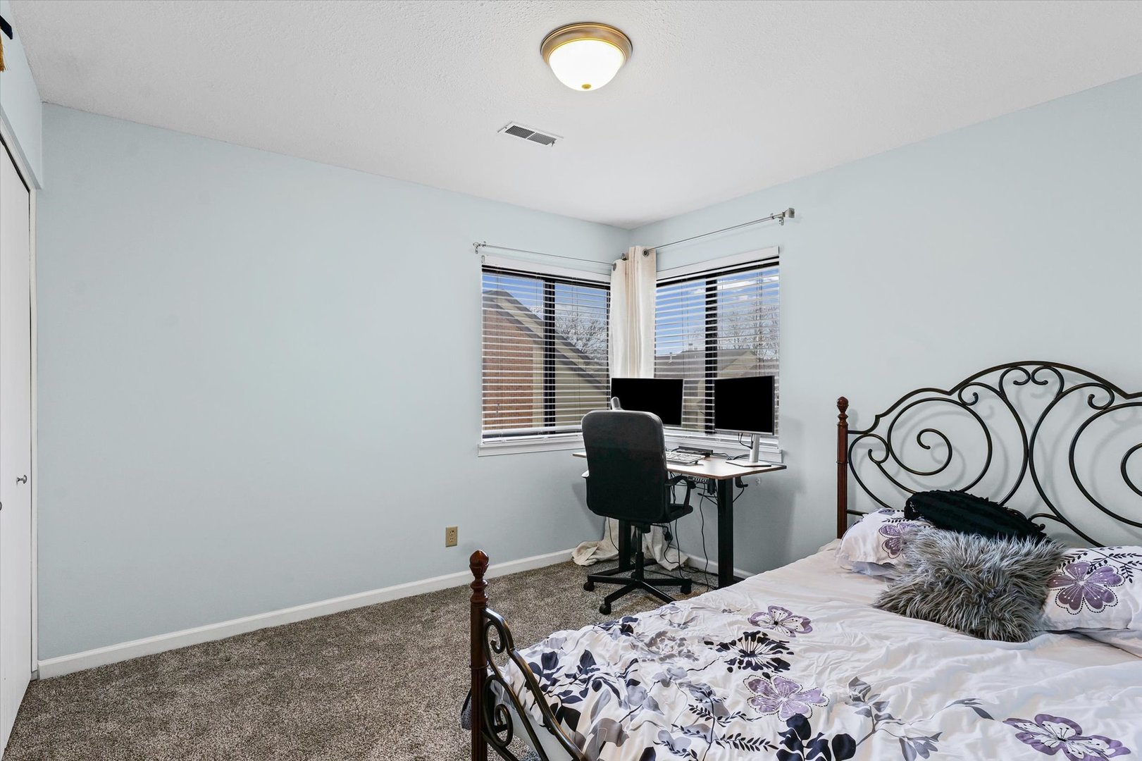 2159 Harbor Town Circle, Unit 2159 Champaign, IL 61821 - Photo 16 of 22 a bedroom that has a bed and a desk in it