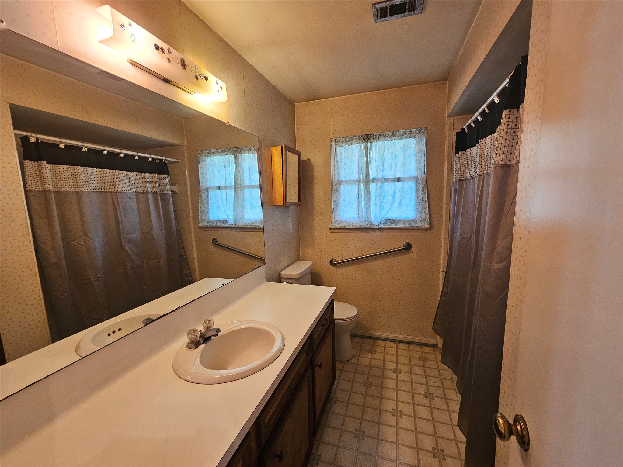 1802 Junker Street Rosenberg, TX 77471 - Photo 8 of 13 a bathroom with a sink a toilet and shower