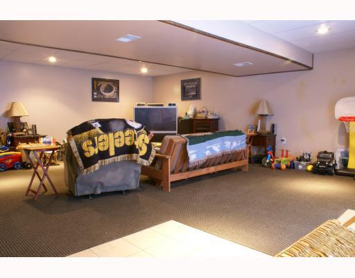 125 Leon Road Green Tree, PA 15220 - Photo 11 of 18 Den/Family/Great Room. Game Room in lower level with recessed lighting, Berber carpeting, sliding glass doors