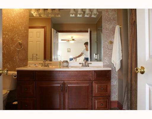 125 Leon Road Green Tree, PA 15220 - Photo 14 of 18 Master Bath/Spa. Master bath with cherry double vanity, spa tub, and white toilet.