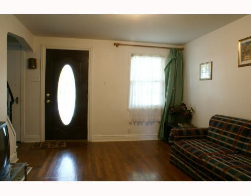 125 Leon Road Green Tree, PA 15220 - Photo 9 of 18 Living Room. Living Room with hardwood floors, white walls. Newer entry door with leaded glass.