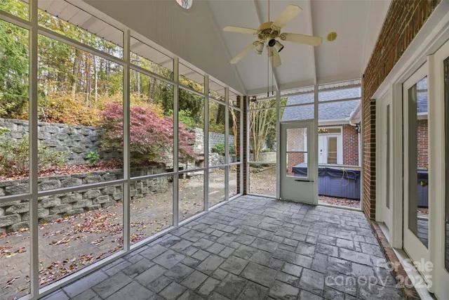 a kitchen with white cabinets and sink