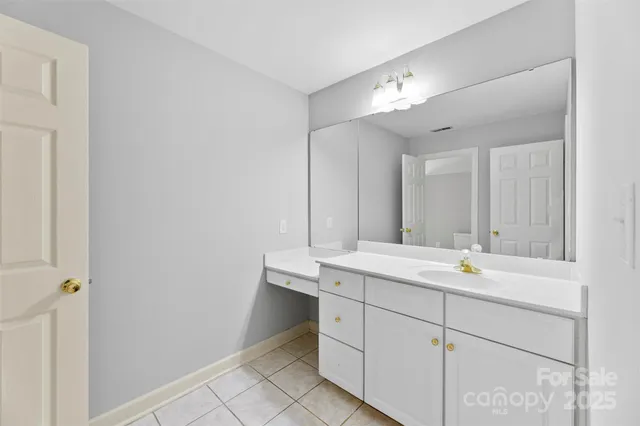 a bathroom with a bathtub a sink a toilet and a mirror