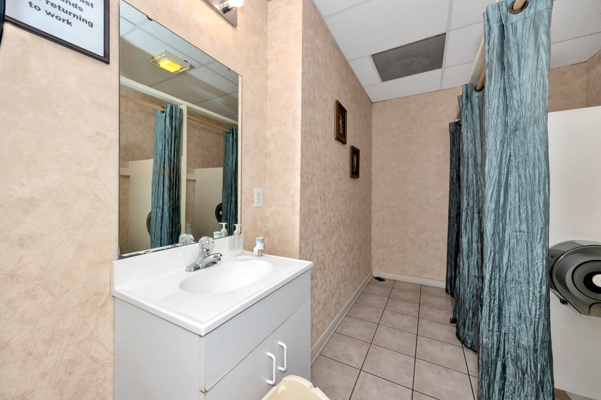 15631 Brownsferry Road Athens, AL 35611 - Photo 14 of 38 a bathroom with a sink a mirror and a shower