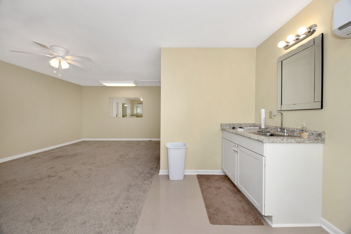 15631 Brownsferry Road Athens, AL 35611 - Photo 33 of 38 a bathroom with a sink a toilet and mirror