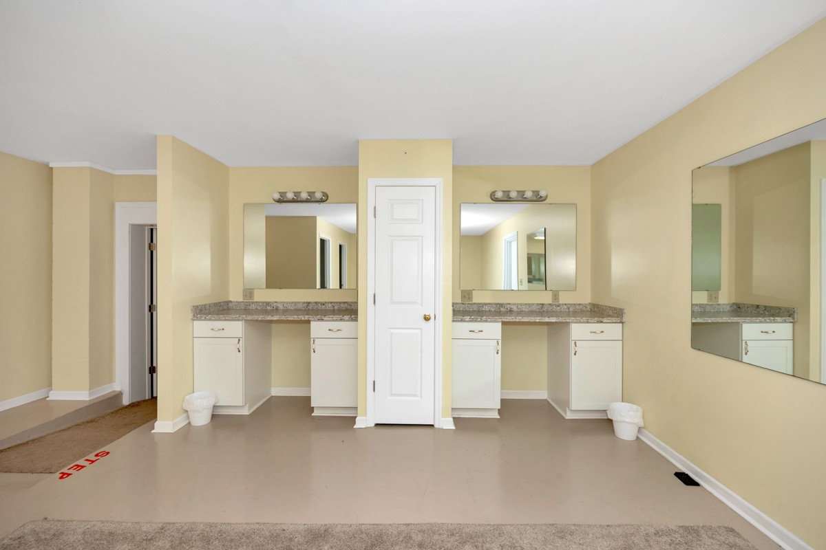 15631 Brownsferry Road Athens, AL 35611 - Photo 35 of 38 a bathroom with a double vanity sink mirror and bathtub