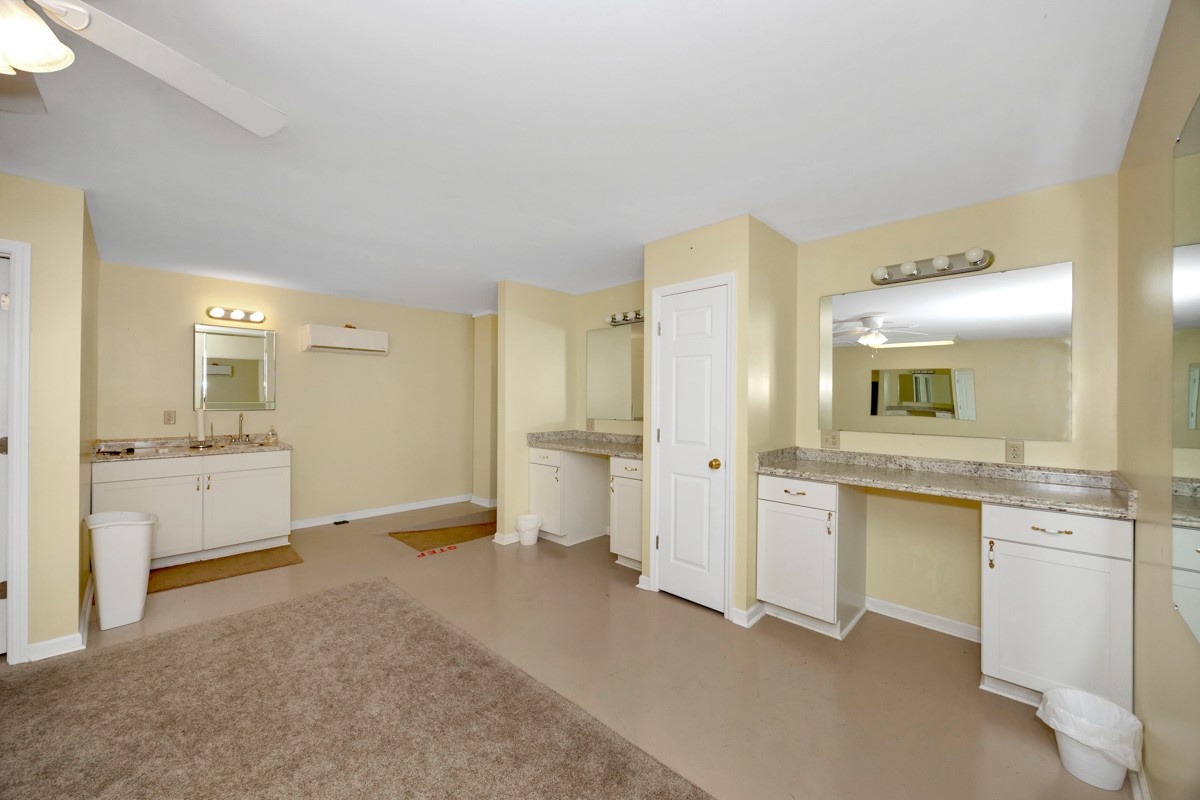 15631 Brownsferry Road Athens, AL 35611 - Photo 36 of 38 a bathroom with a granite countertop sink mirror and toilet
