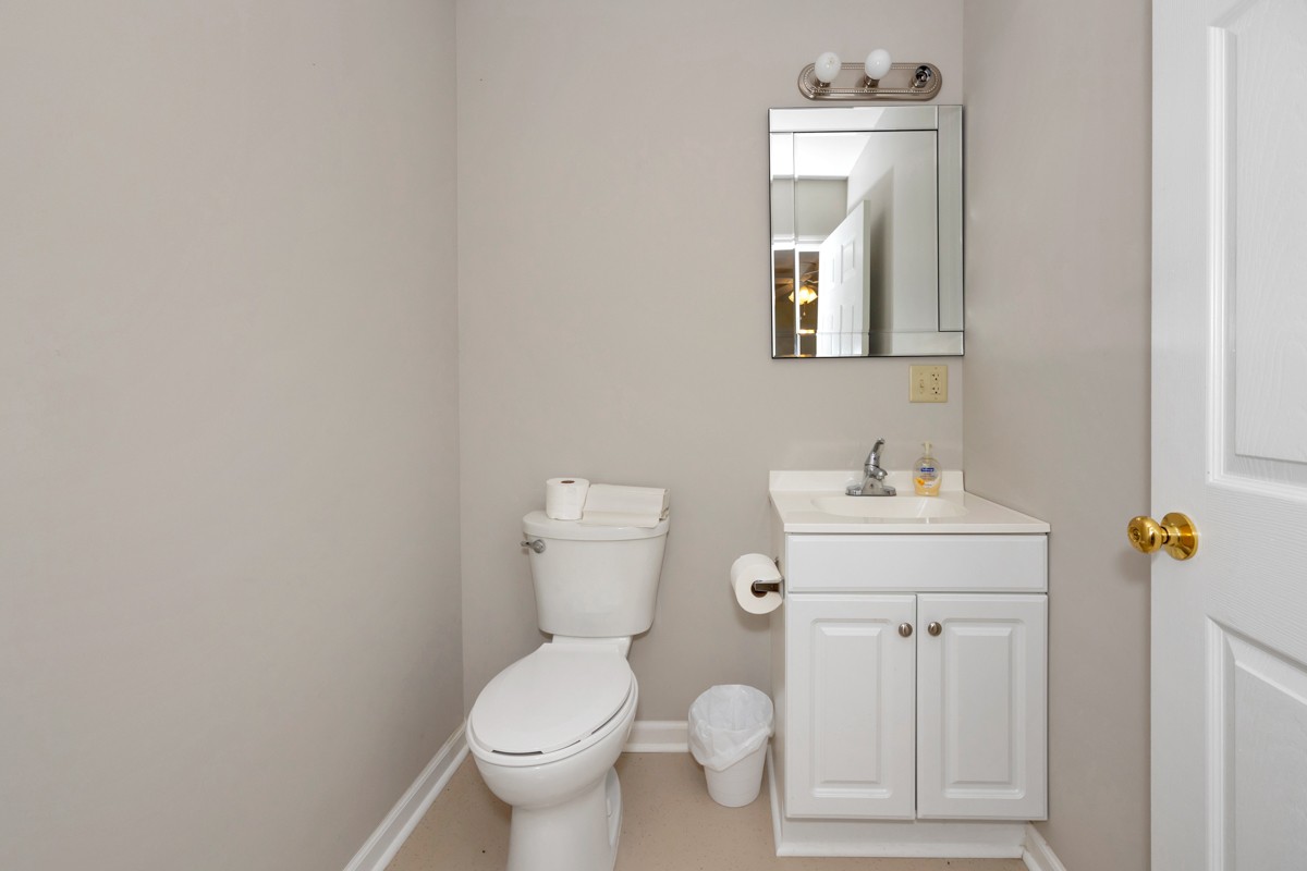15631 Brownsferry Road Athens, AL 35611 - Photo 37 of 38 a bathroom with a toilet sink and mirror