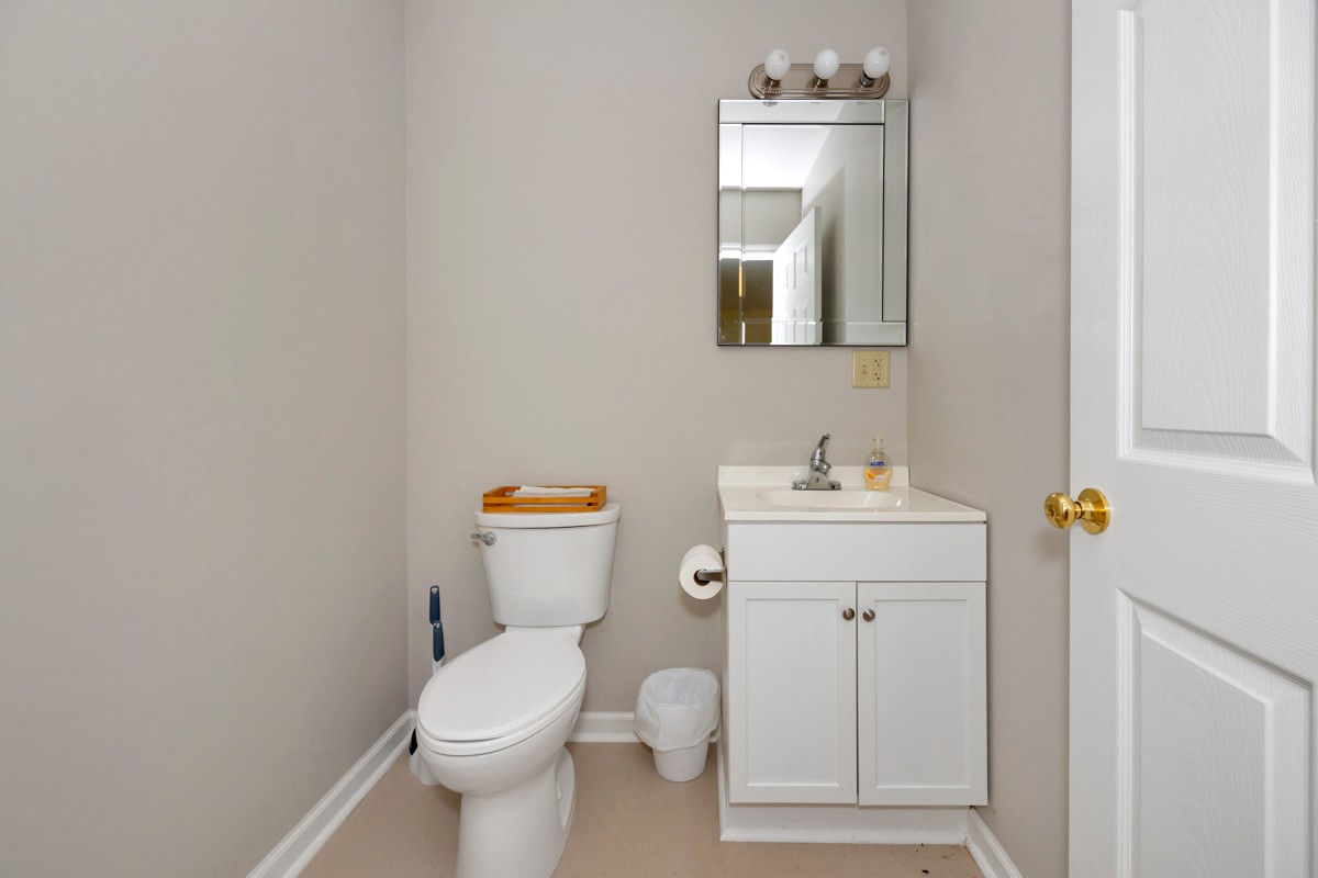15631 Brownsferry Road Athens, AL 35611 - Photo 38 of 38 a white toilet sitting next to a bathroom sink