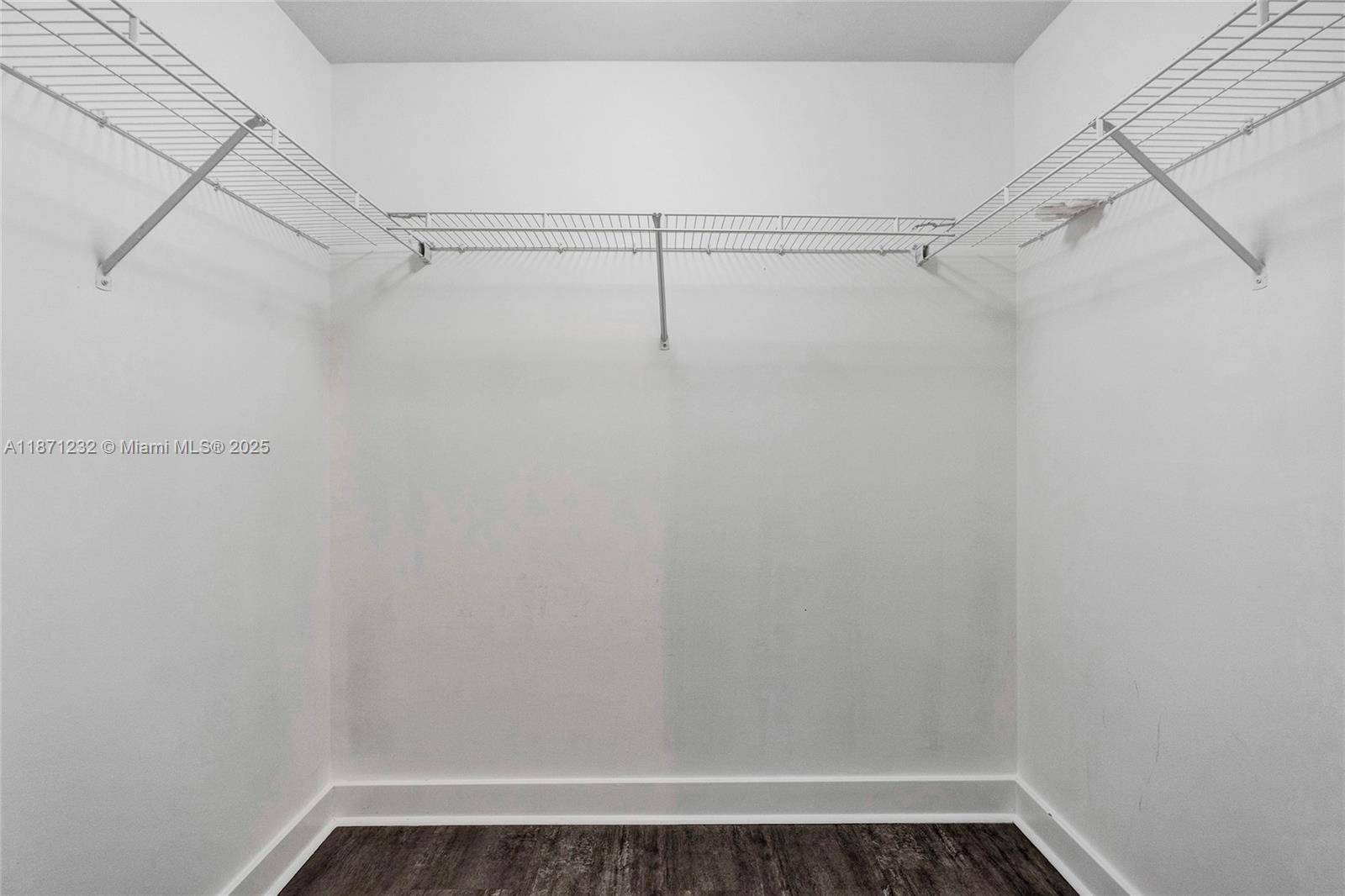 244 Biscayne Boulevard, Unit 406 Miami, FL 33132 - Photo 17 of 28 a view of a room with racks on the wall