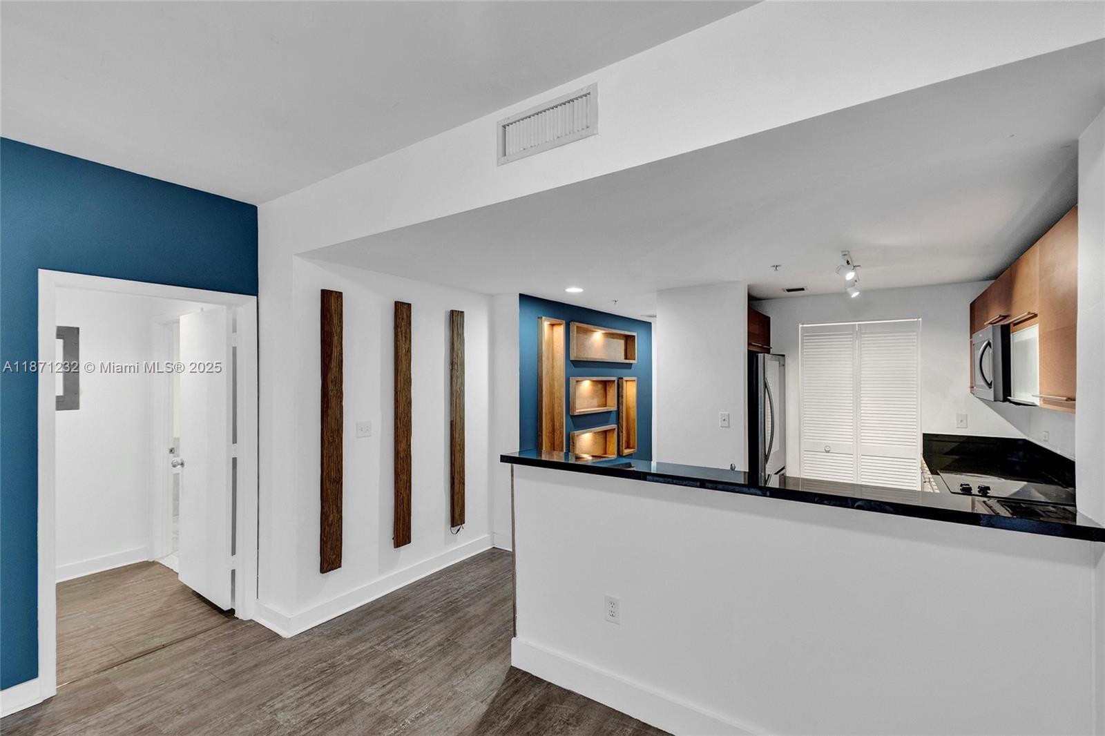 244 Biscayne Boulevard, Unit 406 Miami, FL 33132 - Photo 7 of 28 a view of a car in a room