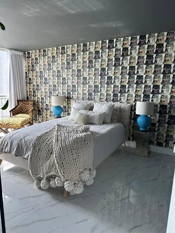 a bedroom with a bed and a couch