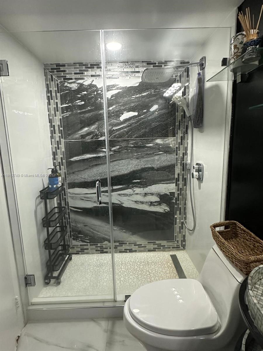 7601 East Treasure Drive, Unit 2022 North Bay Village, FL 33141 - Photo 10 of 16 a bathroom with a toilet and a shower