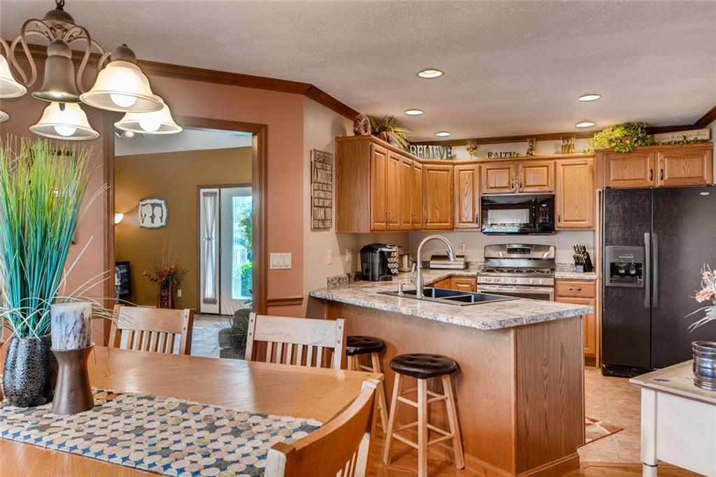 114 Oakland Heights Road Monaca, PA 15061 - Photo 11 of 25 Open Kitchen / Dining area Hardwood flooring, Crown molding, Chair rail