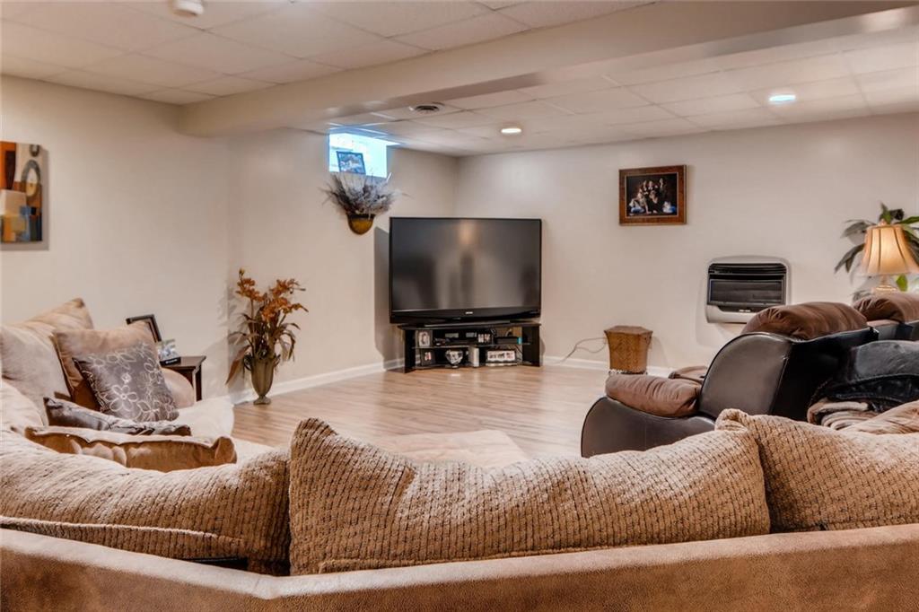 114 Oakland Heights Road Monaca, PA 15061 - Photo 23 of 25 Huge Family-TV room with Recessed lighting, Laminate and Carpeted Flooring and a gas Wall Heater
