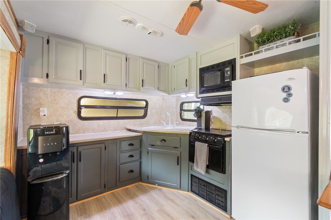 7945 Lake Road, Unit 86 Sodus, NY 14555 - Photo 14 of 22 Great GALLEY kitchen area! Plus there are so many